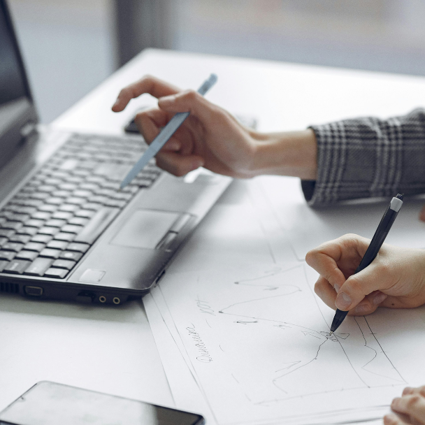 Expert pointing at financial charts